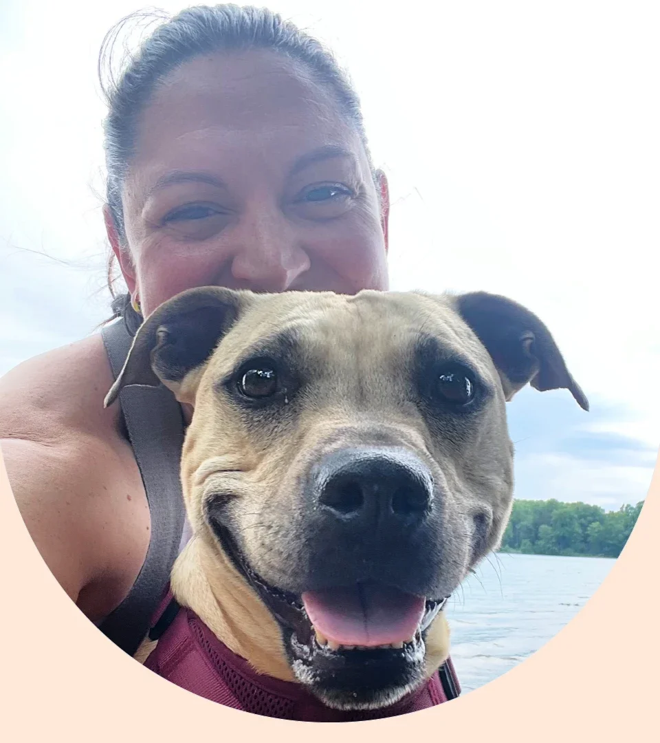 Katie Leonard is pictured holding her dog Daisy.