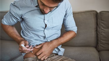 Health: Stelara: man doing stomach injection 923681836