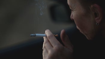 glp-1-agonists: closeup hand holding a cigarette 1447094869