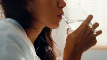 Diet Nutrition: closeup woman drinking glass of water 1403115199