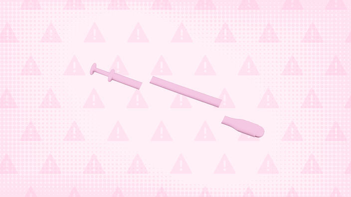 In the center of a light pink background with texture and warning sign pattern is a pink vaginal insertion applicator cut into thirds. 