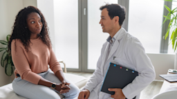 A doctor and a patient talking.
AzmanJaka/E+ via Getty Images  