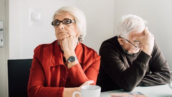 Health: Health Insurance: senior couple distressed paperwork 942193004