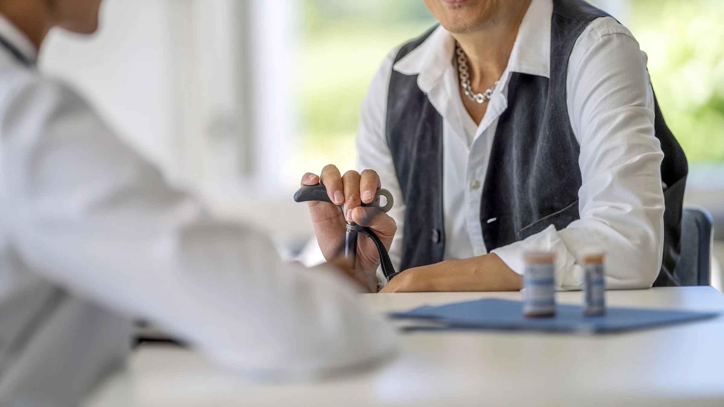 Close-up patient speaking to doctor about medication