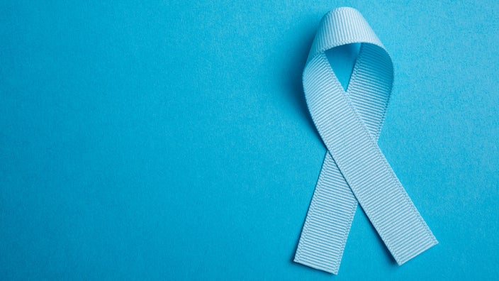 Blue cause ribbon on a blue background.
