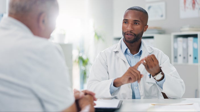 Doctor discusses treatment plan with patient.