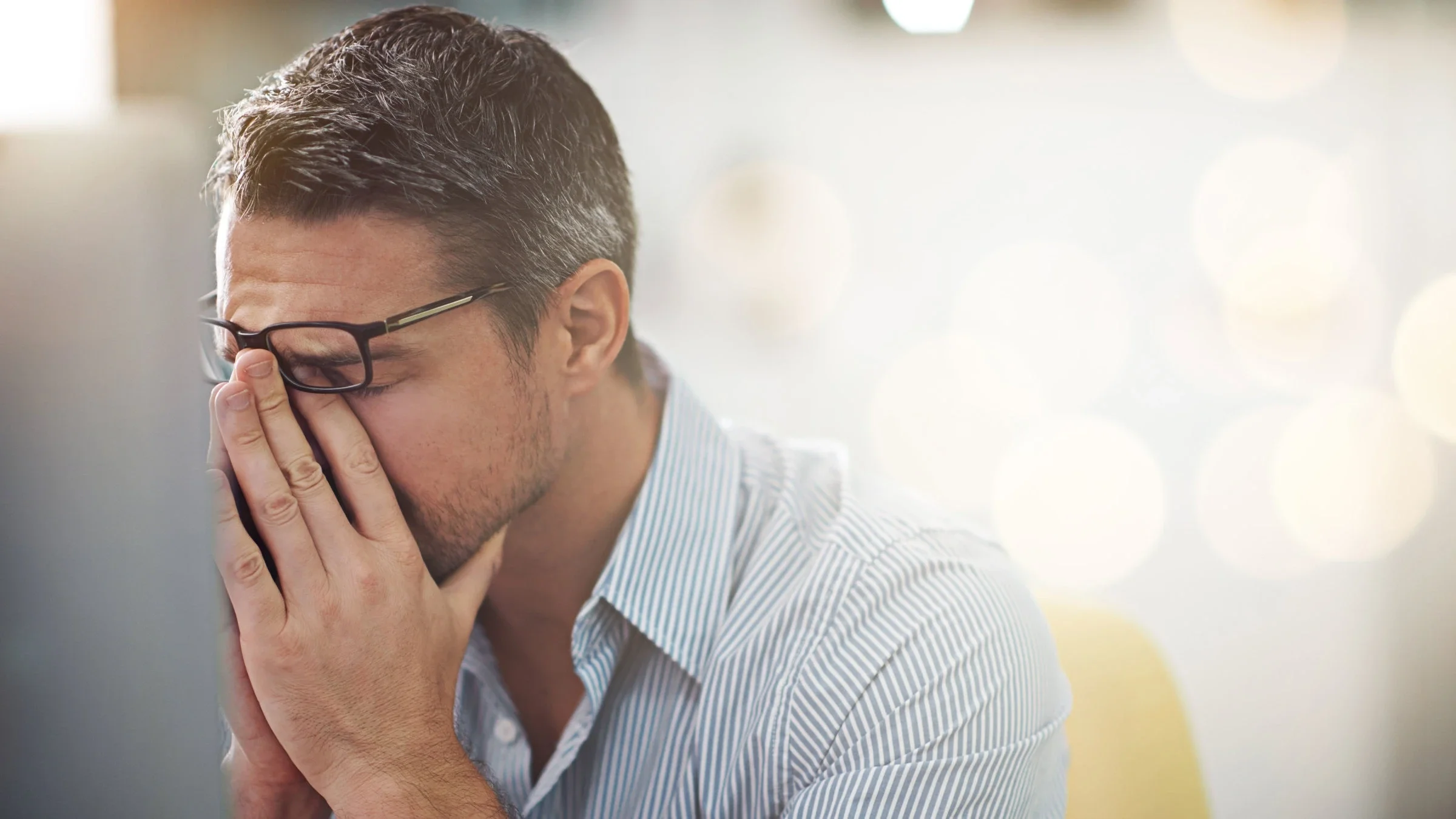 A man looks stressed and anxious.