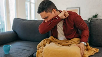 COVID: man with a cough 1429951071