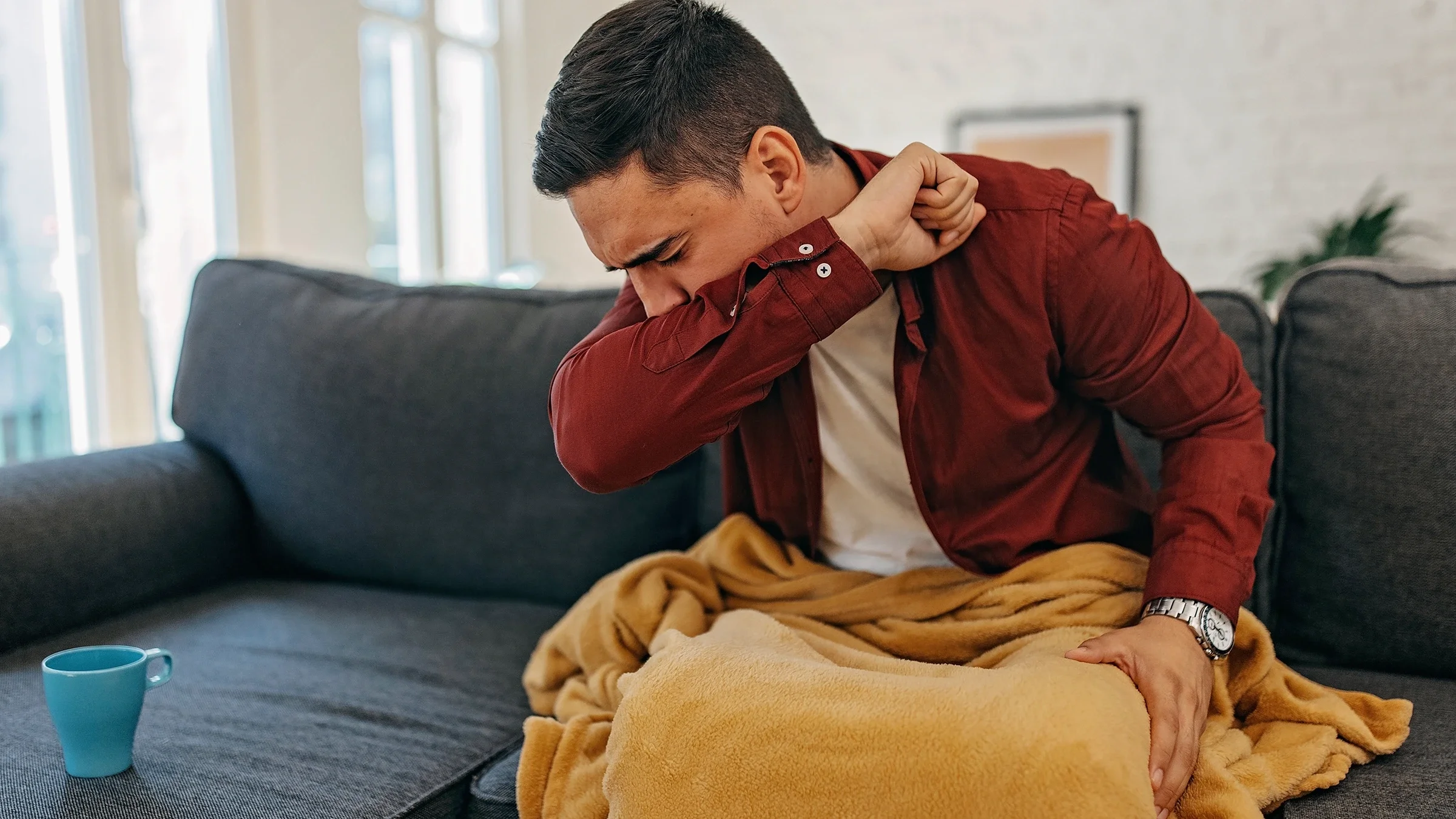 A man at home with a cough.