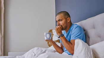 Cough: man coughing in bed 1355106280