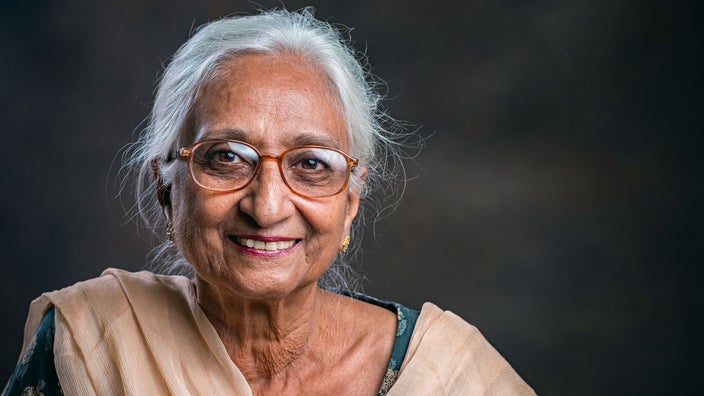 A woman wears glasses. There are certain activities you should avoid after having cataract surgeries, such as reading, lifting heavy objects, and showering.