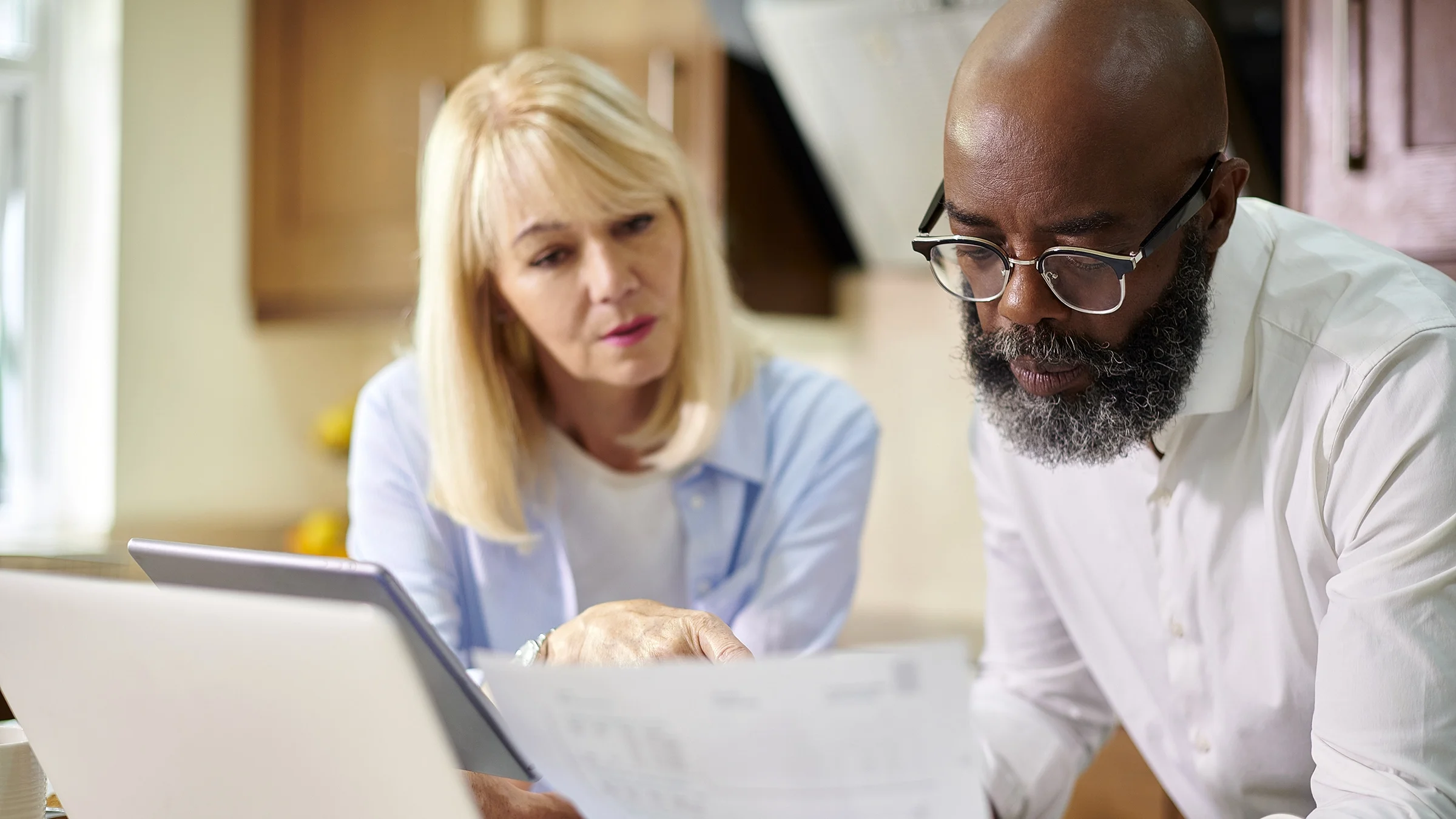 A couple checks their finances online.