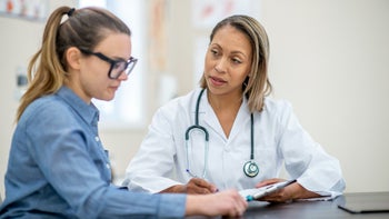 HCP: Diagnosis: patient speaking with medical professional 1152497402
