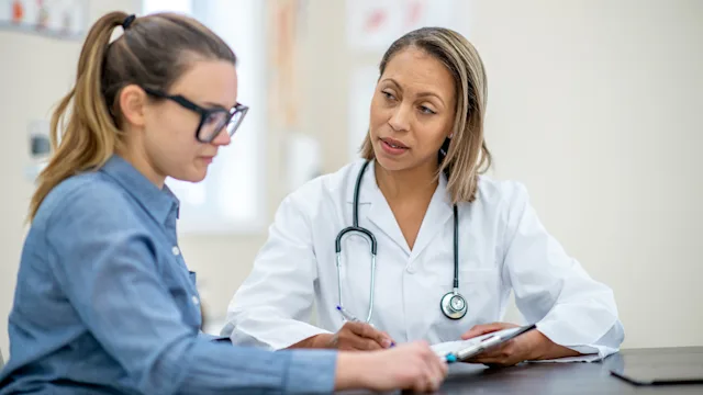 HCP: Diagnosis: patient speaking with medical professional 1152497402