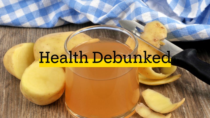 Shown is a glass of potato juice with its ingredient.