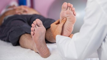 Neurological: Neuropathy: doctor examining feet 636209414