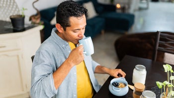Linzess: man drinking coffee at home 2167941711