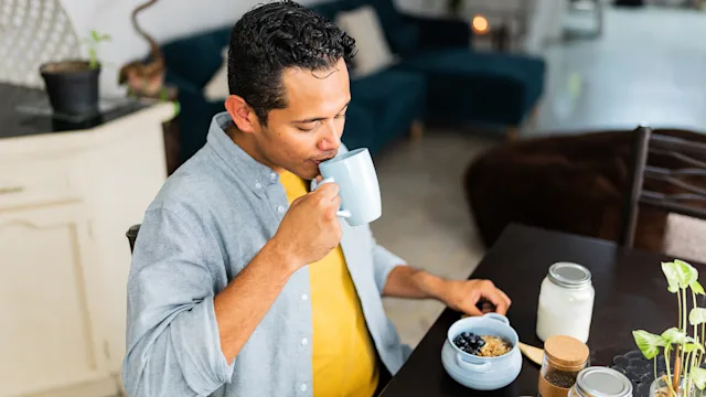 Linzess: man drinking coffee at home 2167941711