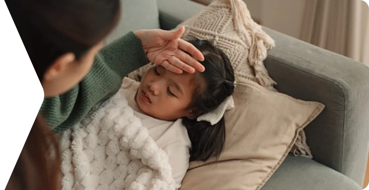 Mother feeling warm forehead of child