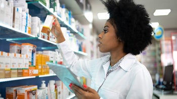 pharmacist doing inventory 1344251576