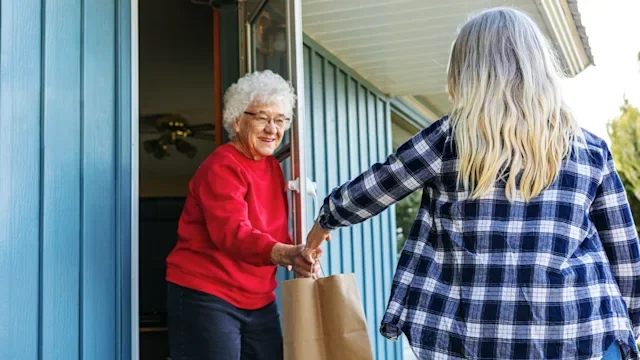 Health insurance: food delivery to womans doorstep 1217292292