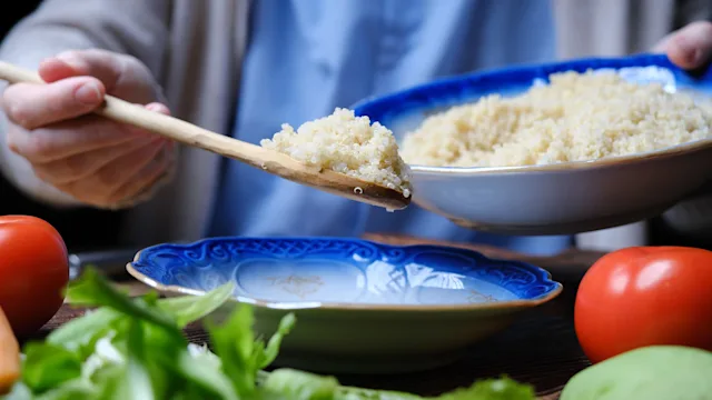 diet-nutrition: closeup spoonful of quinoa 1383814721