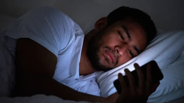 Sleep: man mobile device in bed 1326517784