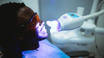 Health: Dental care: patient blue whitening treatment 1386515815