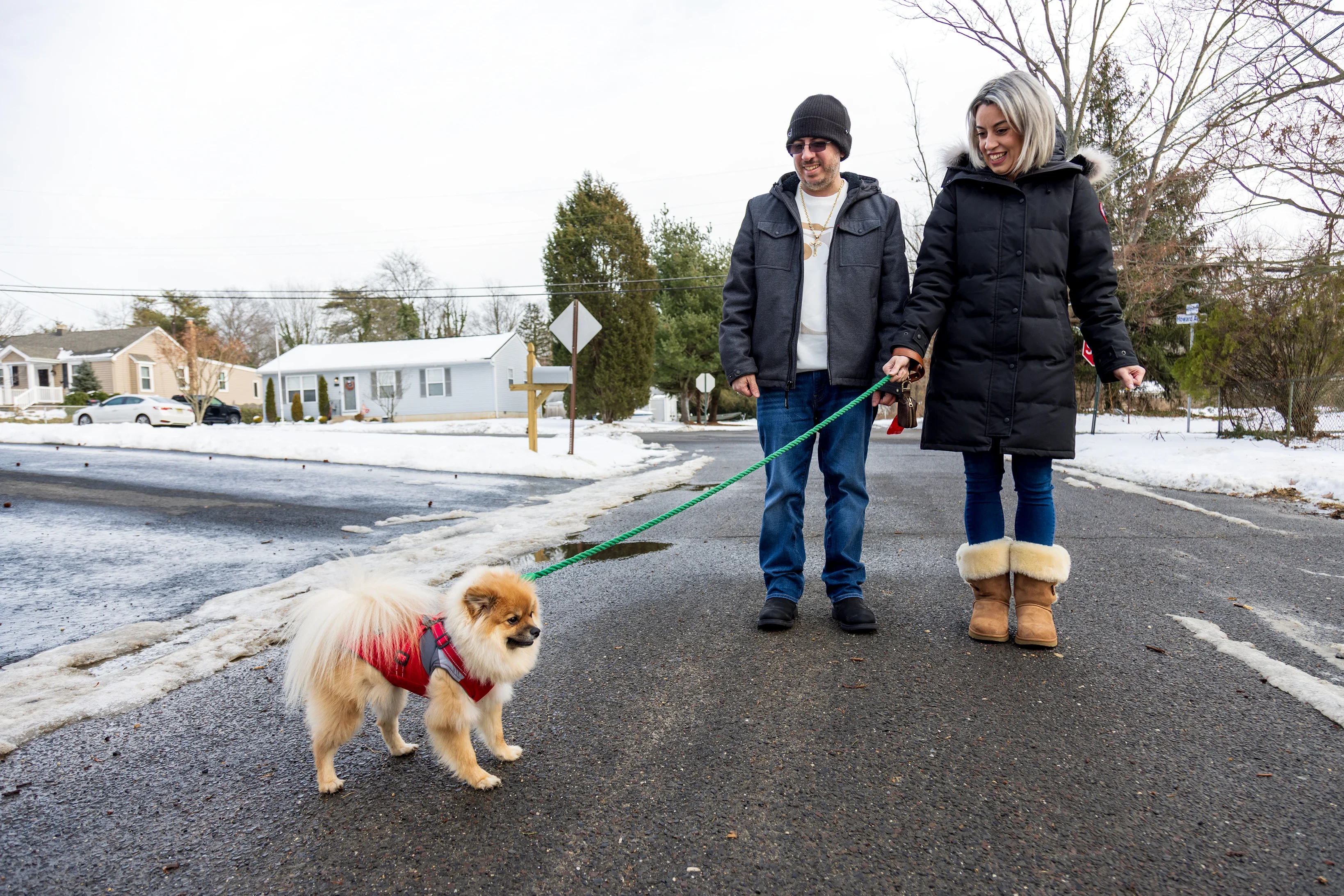Kat Carollo goes for a walk with her husband, Gaspare, and their dog, Louie.