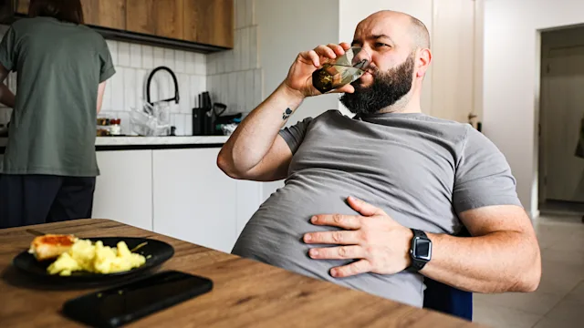 Wegovy: man drinking water after meal 2222144605