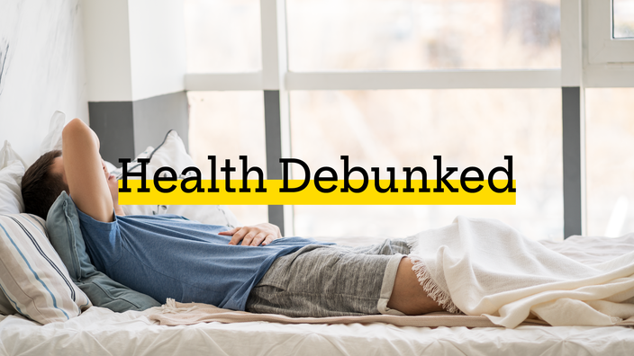 Person laying in bed with their arm covering their eyes and forehead. There is added text on top reading “Health Debunked” with a yellow highlight behind it.