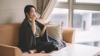Mirtazapine: woman taking pill with water 1167529091