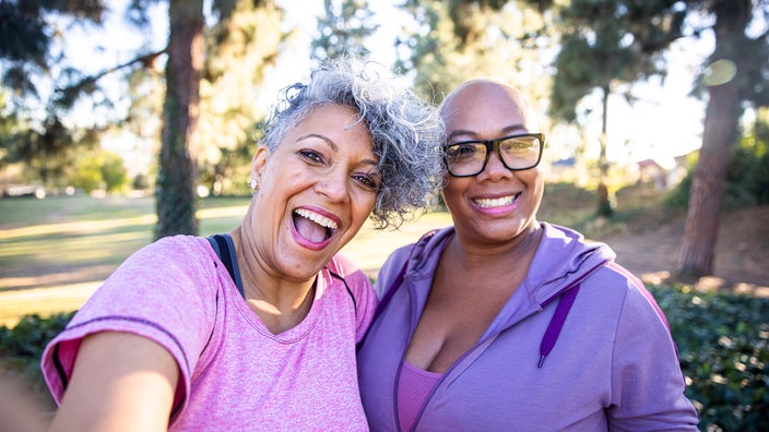 Senior women hanging outside taking a selfie.