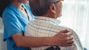 caregiving: caregiver with senior patient 1471084563