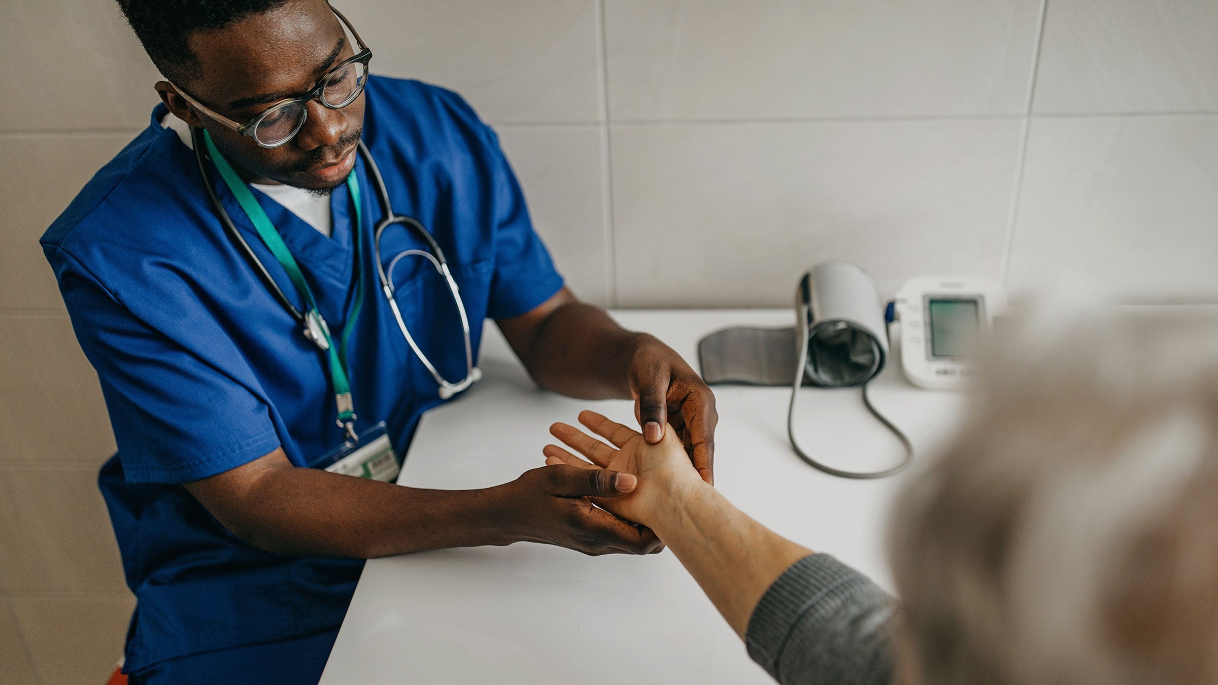 Arthritis: patient wrist examined 1289421913