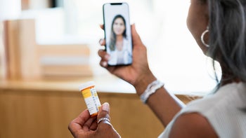 Amitriptyline: Interactions: woman reads Rx telehealth 1354411928