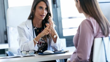 Metformin: Pregnancy: doctor talking to pregnant patient 1174586092