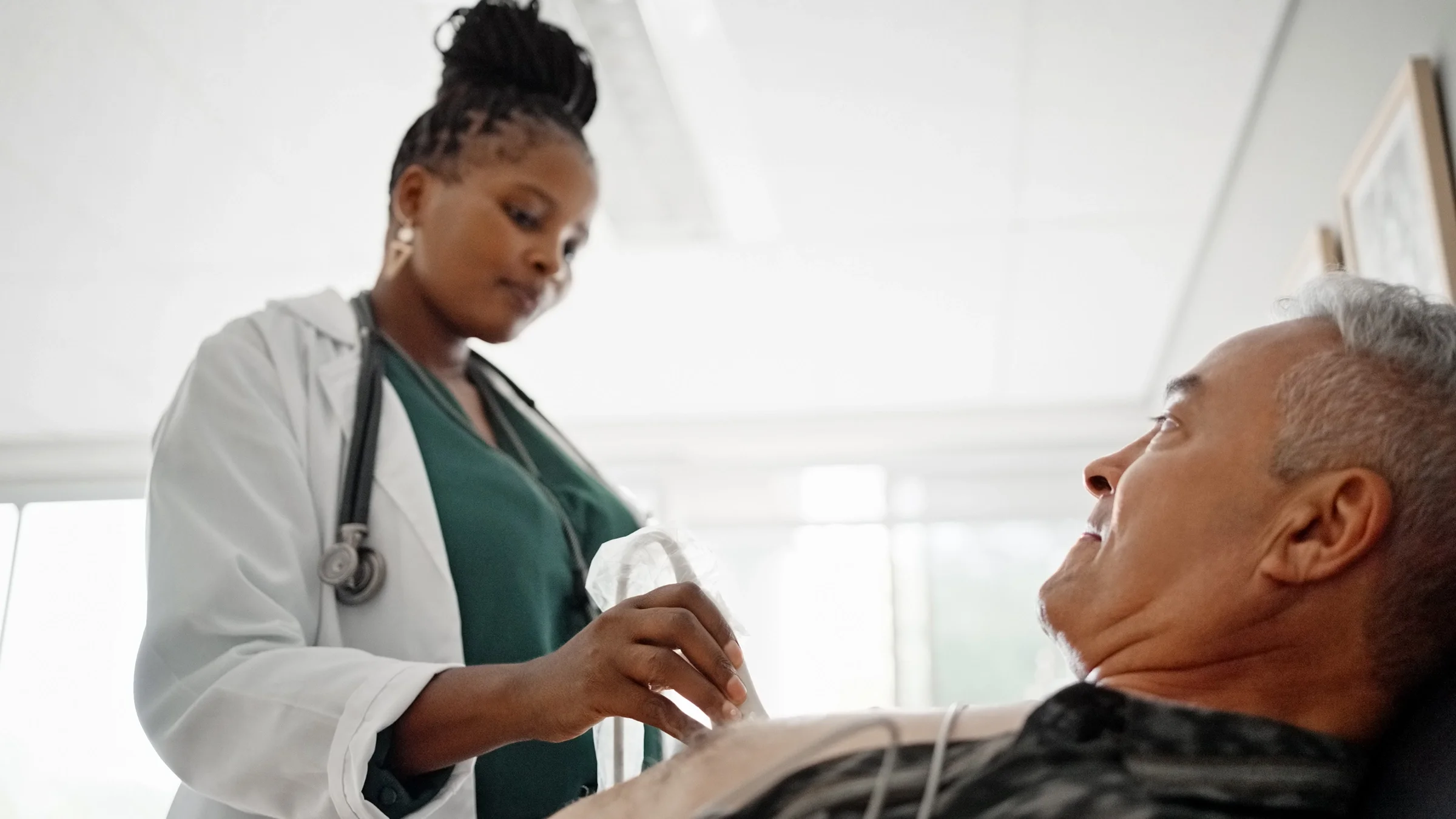 Man getting cardiac ultrasound examination.