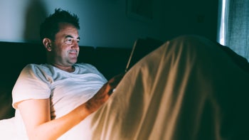 Sexual Health: man watching tablet in bed 1352048953