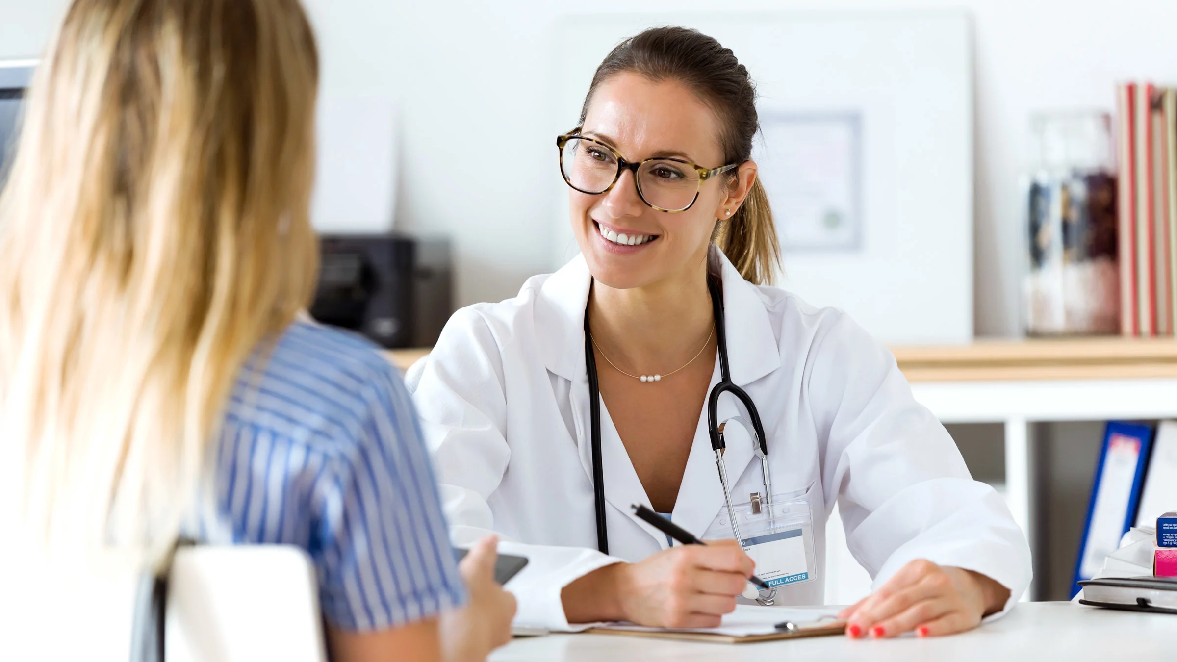 A doctor explaining a diagnosis to a patient.