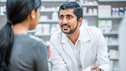 Pharmacist consulting with patient at counter.
FatCamera/E+ via Getty Images