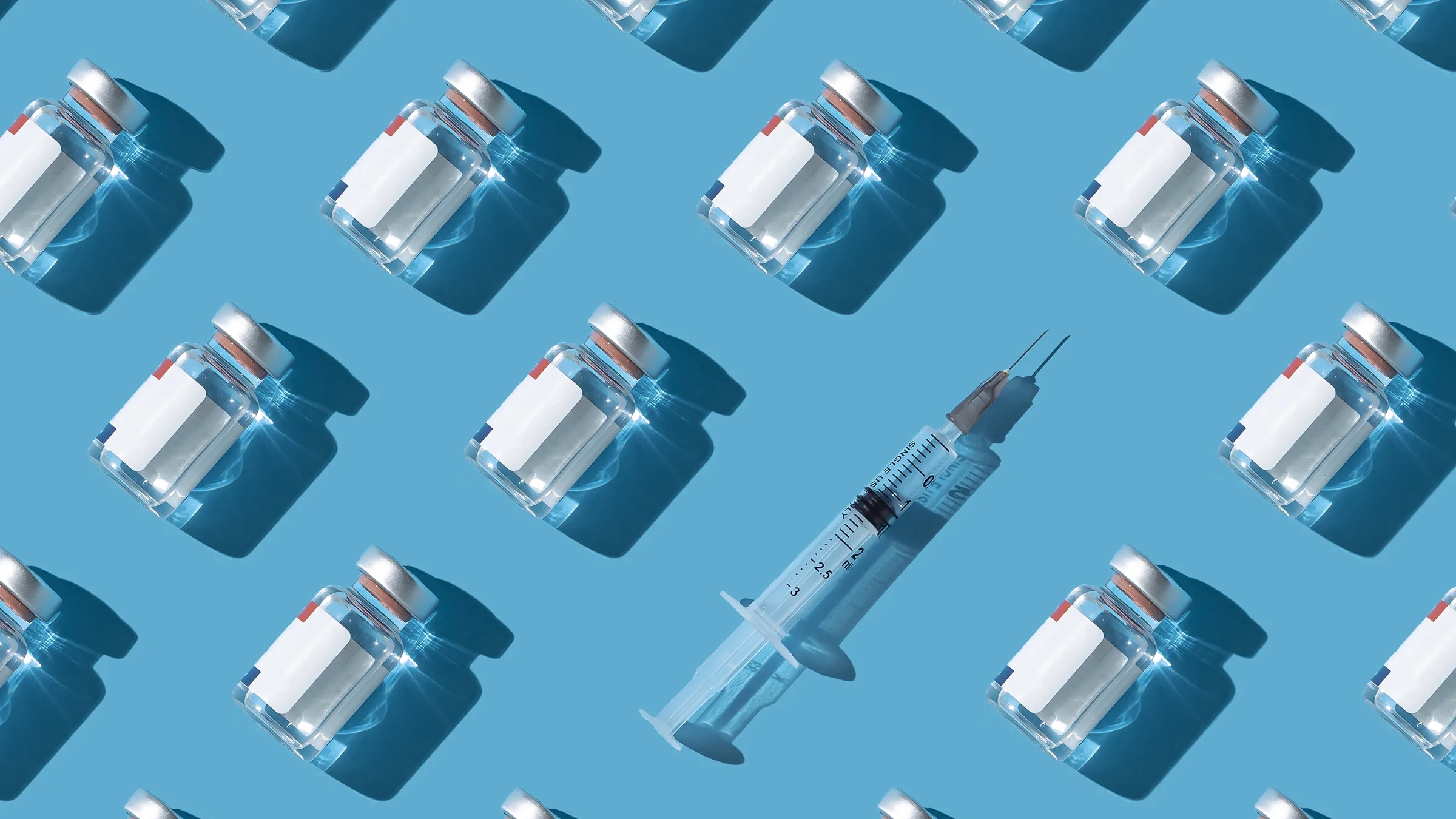 Vaccine vials and a syringe displayed against a cyan background.