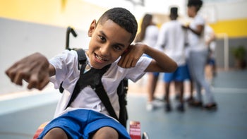 Spinal Muscular Atrophy: student in wheelchair sports court 1281045590