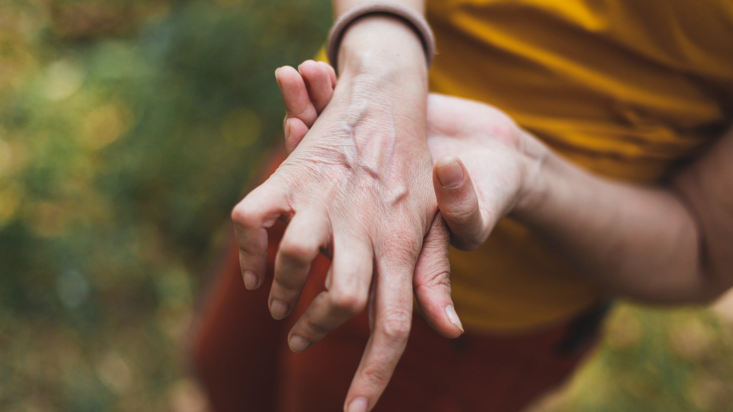 Rheumatoid arthritis: massaging arthritic hand 1204788026