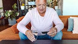 A man is holding a blister pack of pills.
vitapix/E+ via Getty Images 
