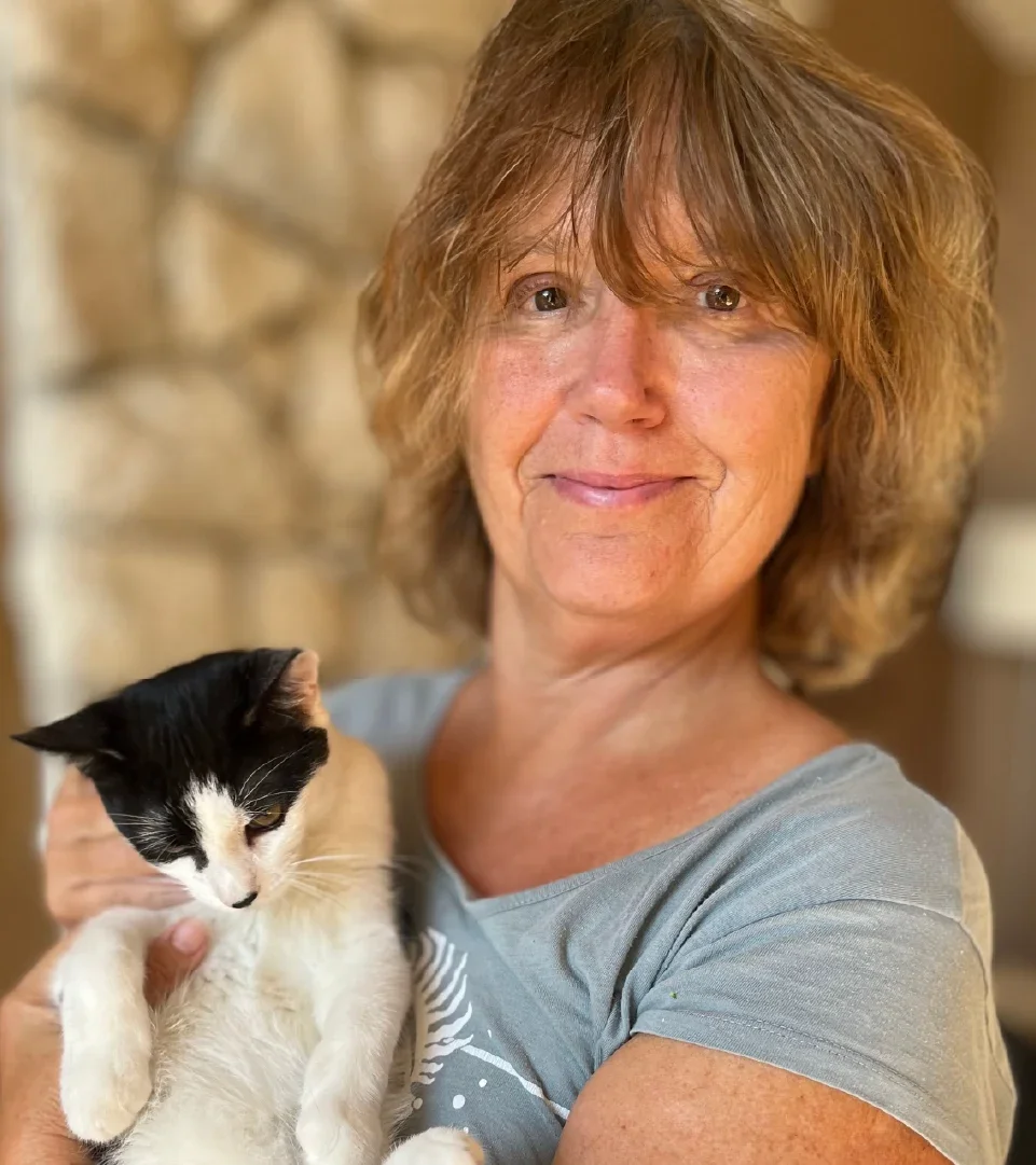 Brenda Rees is pictured holding her cat.