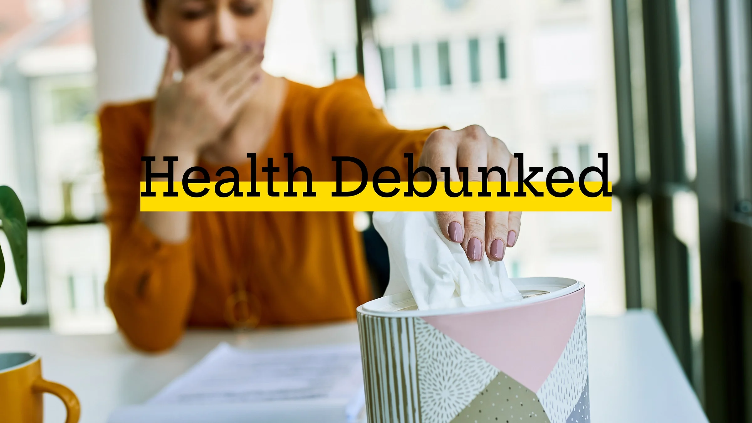 Close-up of a woman. She is taking tissue from a box.