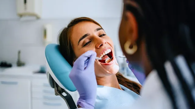 Dental-care: woman at dental exam 2166227001