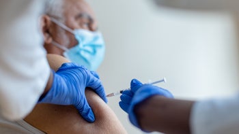 Medicare: Shingles vaccine: senior man getting shingles shot 1314562834