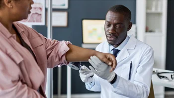 HCP: Psoriasis: HCP examining patient arm 2186297842